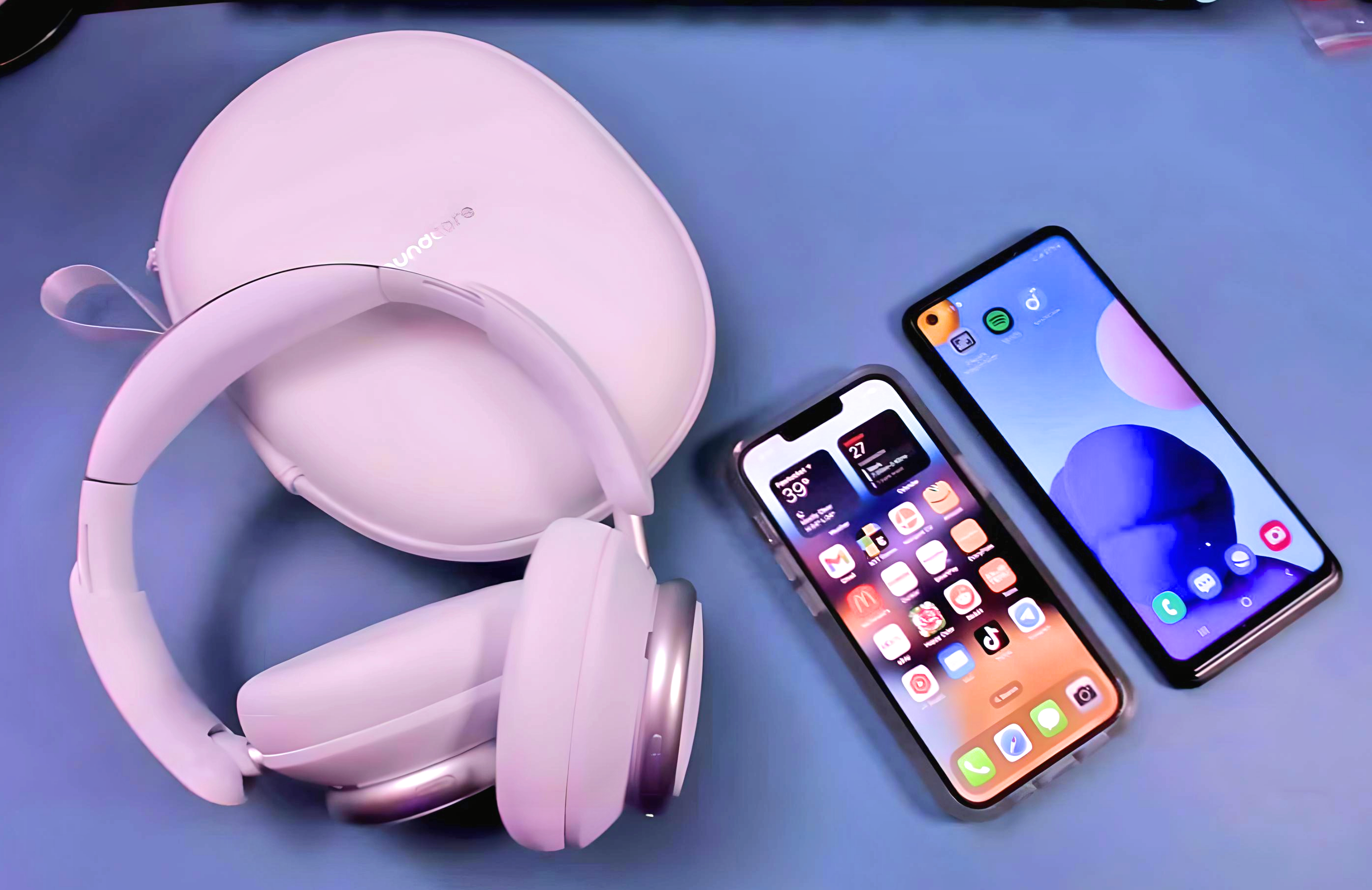 The Soundcore Space Q45 headphones depicted with an iPhone and Android phone, showing the headphone's multi-device Bluetooth pairing feature.